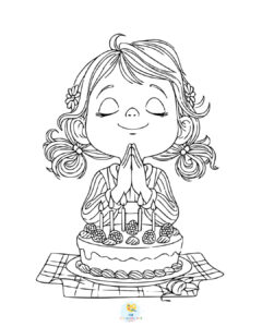 Girl praying before cutting birthday cake
